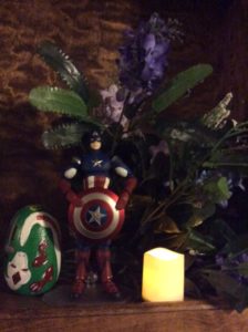 Captain America shrine with lilacs and pisanka